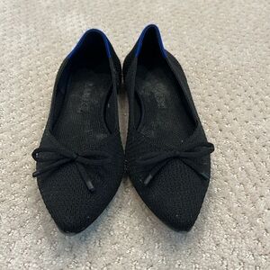 Rothy’s black pointed toe flat with bow